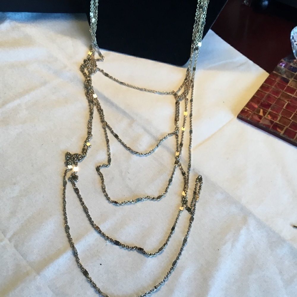 $12 or 3/$25. 5 Strand Goldtone Necklace